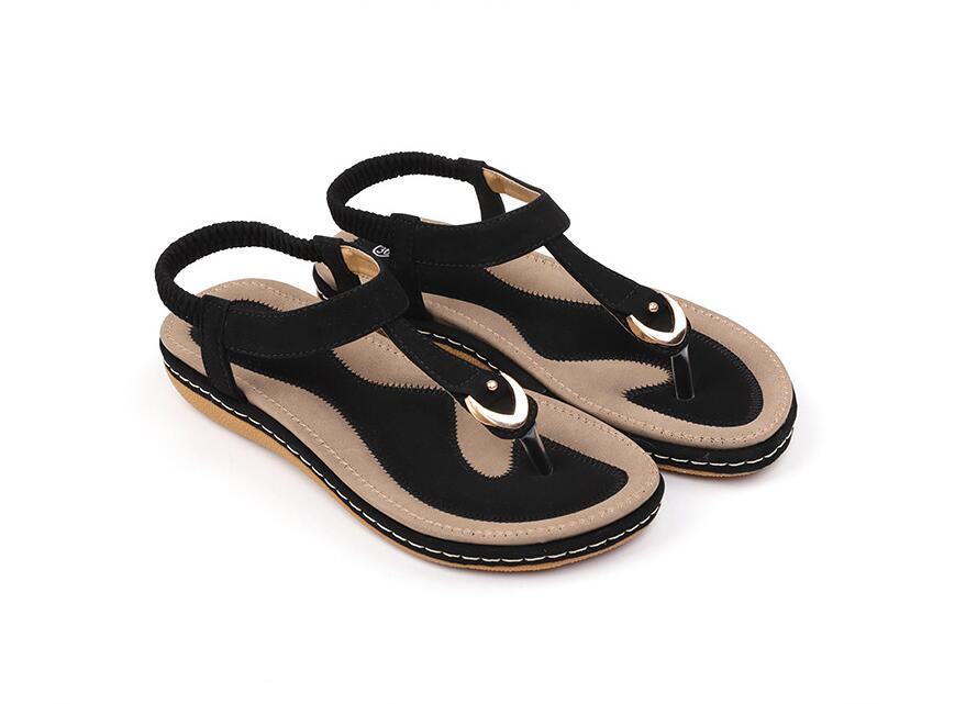 Ladies' chic beach flip flops by MANDOTOS INTERNATIONAL with stylish straps and comfortable soles, perfect for summer outings.