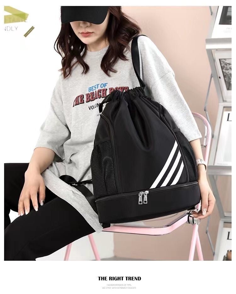 Large basketball backpack by MANDOTOS INTERNATIONAL featuring a drawstring closure and spacious front pocket for storage.