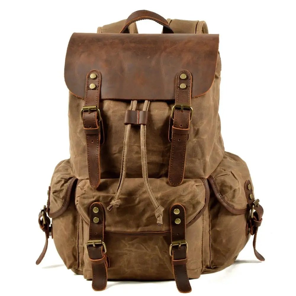 Men's vintage batik canvas leather backpack with adjustable straps and multiple compartments by MANDOTOS INTERNATIONAL.