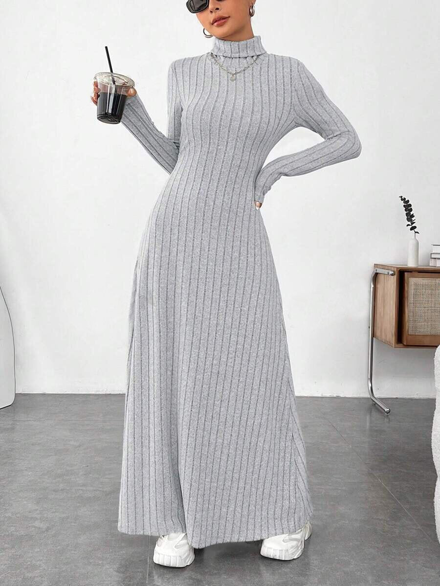 Mandotos INTERNATIONAL stylish high collar dress from the winter fashion collection, featuring a sleek design and cozy fabric.