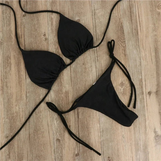 Mandotos International women's solid micro bikini set with tie-side G-string thong, bandage Brazilian swimwear, perfect for summer beach.