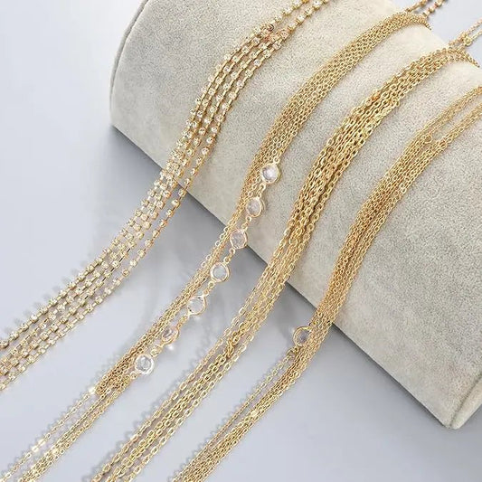 Women's gold body chain necklace and bikini jewelry set with four pieces, featuring delicate chain details and stylish design.