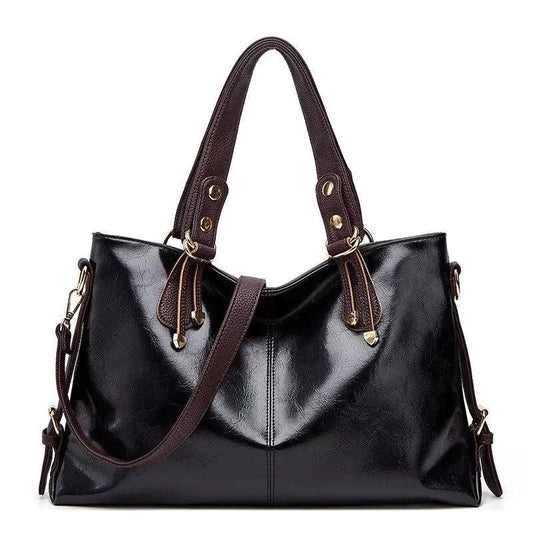Mandotos Kathie leather tote purse with spacious interior, sturdy handles, and elegant design in natural leather finish.