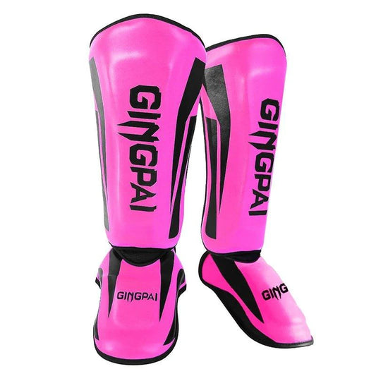 Mandotos kickboxing shin guards and Muay Thai leg protectors for training and sparring, black protective gear with adjustable straps.