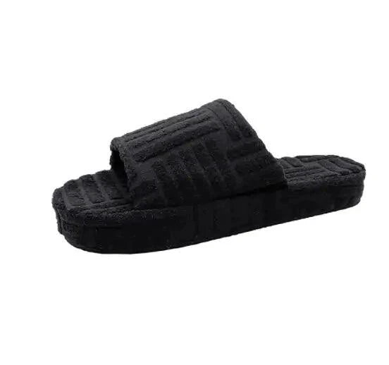 Soft pink ladies' plush slip-on slippers by MANDOTOS with cozy fleece lining and a non-slip sole for comfortable indoor wear.