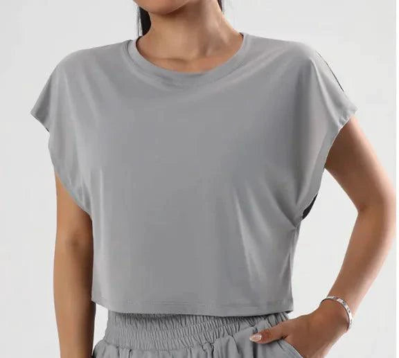 Lady wearing MANDOTOS Ladies' Summer Breeze Tee, lightweight cotton top with short sleeves and a relaxed fit.