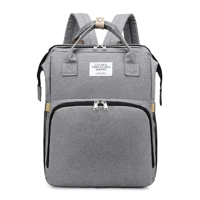 Large-capacity MANDOTOS mommy bag with multiple pockets and adjustable straps, designed for moms to organize essentials.