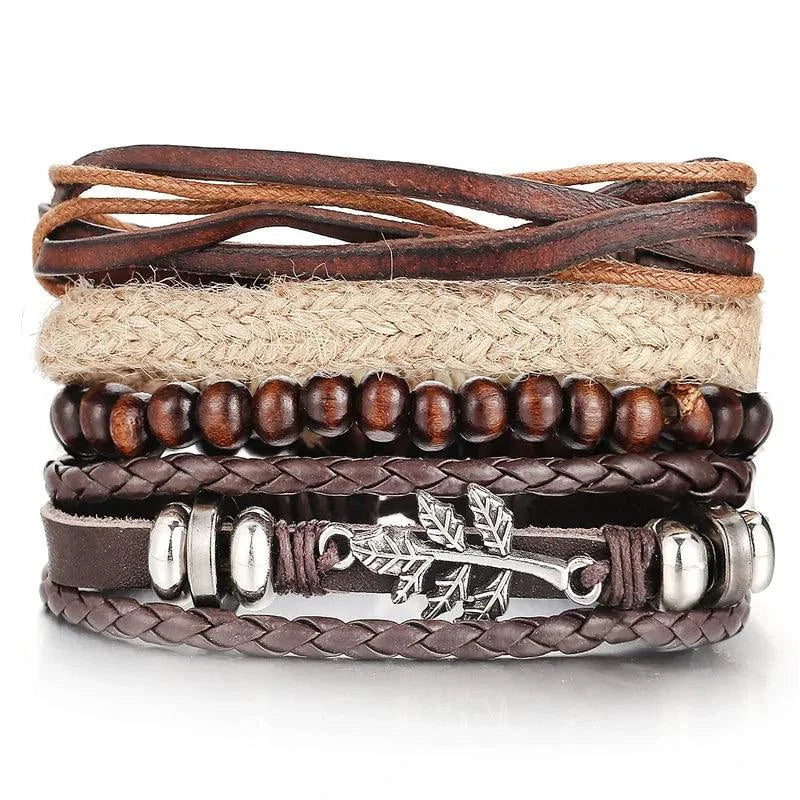 Layered leather charm bracelet by MANDOTOS featuring multiple leather straps and metal charms for a stylish accessory.