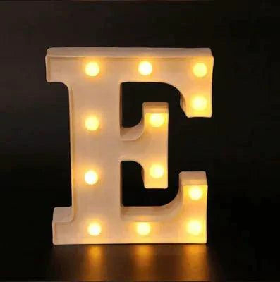 Mandotos luminous letter lights spelling out decorative characters on a wall, ideal for home or party decor.