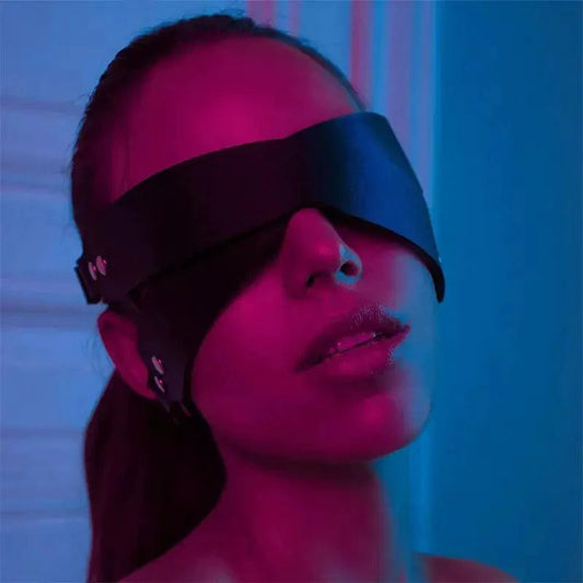 Luxury leather sleep mask by MANDOTOS featuring soft, dark brown leather and an adjustable strap for comfortable nighttime wear.