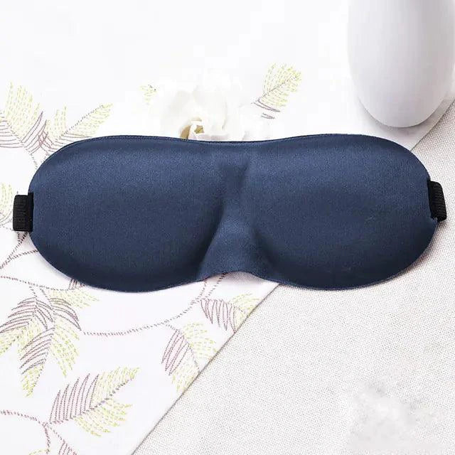 Luxury silk memory foam sleep mask by MANDOTOS with soft silk exterior and contoured shape for comfortable, restful sleep.