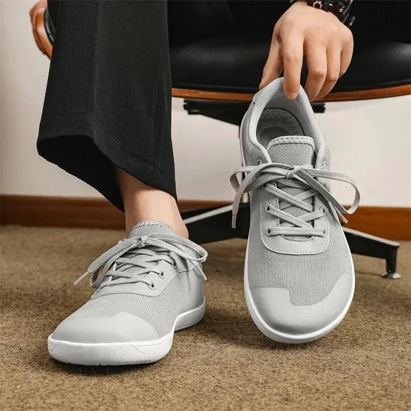 Mandotos men's breathable wide toe mesh running shoes with lightweight responsive sole for comfortable support.