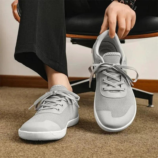 Mandotos men's breathable wide toe mesh running shoes with lightweight responsive sole for comfort and support during exercise.