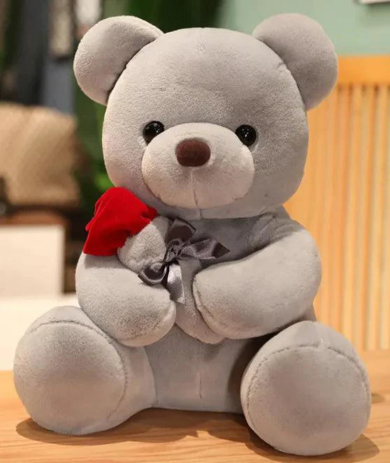 Mandotos Cuddly Rose Teddy Pillow with red rose detail and plush bear in 25, 35, or 45 cm sizes, soft and decorative.