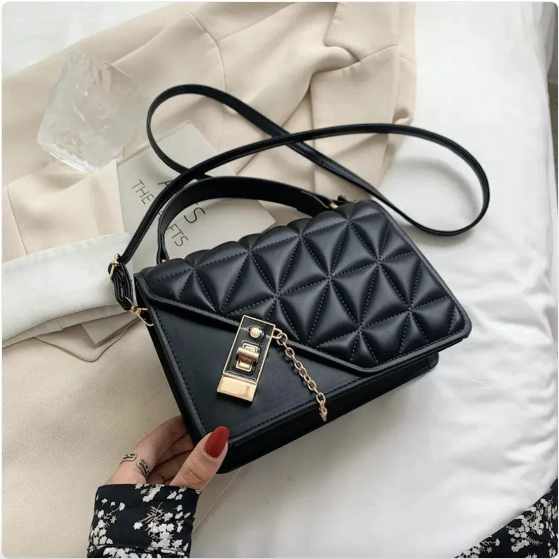 Mandotos black rhombus pattern PU leather shoulder bag, compact messenger with zipper closure, 22x14x7 cm.