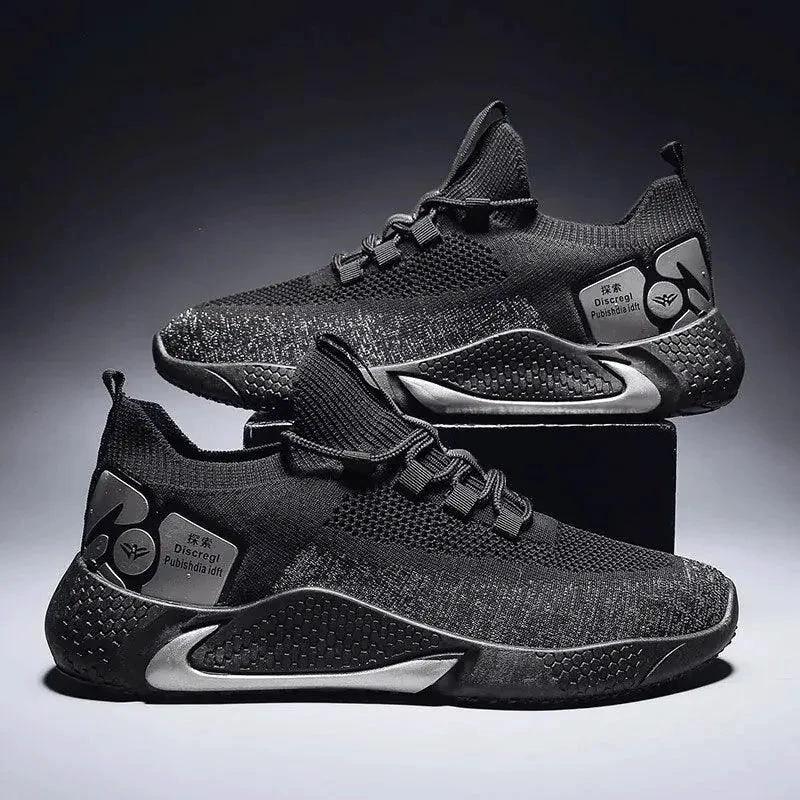 Men's athletic trainer shoes by MANDOTOS with breathable mesh upper and cushioned sole, designed for active wear and sports.