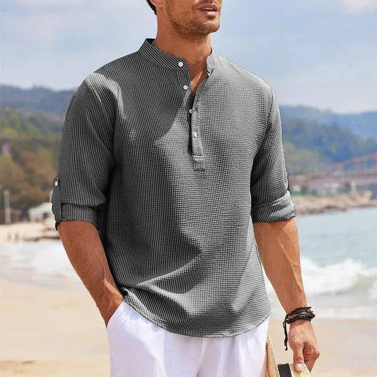 Men's casual long sleeve shirt by MANDOTOS with stand collar and solid color, suitable for everyday men's clothing style.