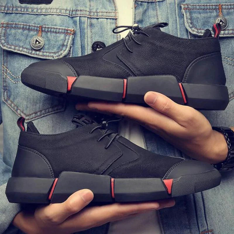 Men's chic leather sneakers by MANDOTOS featuring stylish design and comfortable fit, shown in a sleek black color.