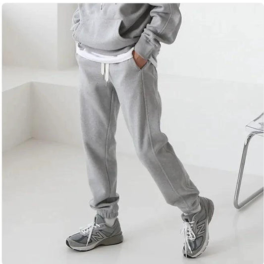 Men's hooded sports sweatshirt by MANDOTOS featuring a comfortable fit, casual style, and a front pocket, shown in dark gray.