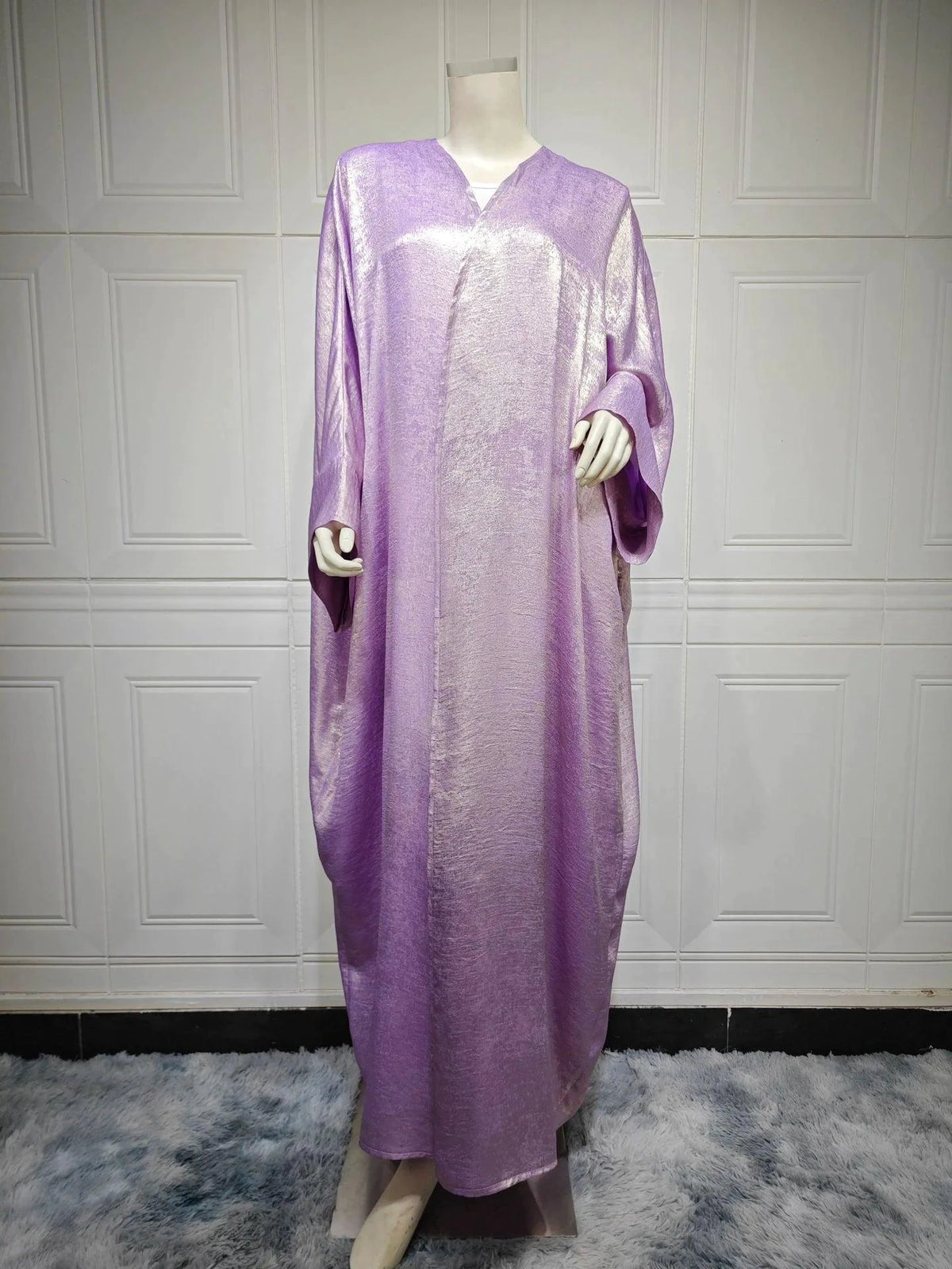 Mandotos Muslim robe abaya in black with flowing fabric and elegant design, full-length traditional Islamic dress.
