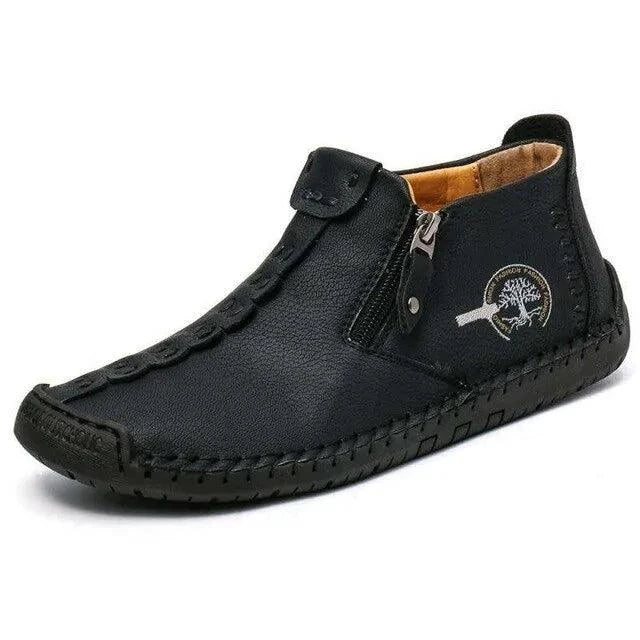 Mandotos premium microfiber leather boots featuring a sleek design, rounded toe, and stylish ankle-high silhouette.