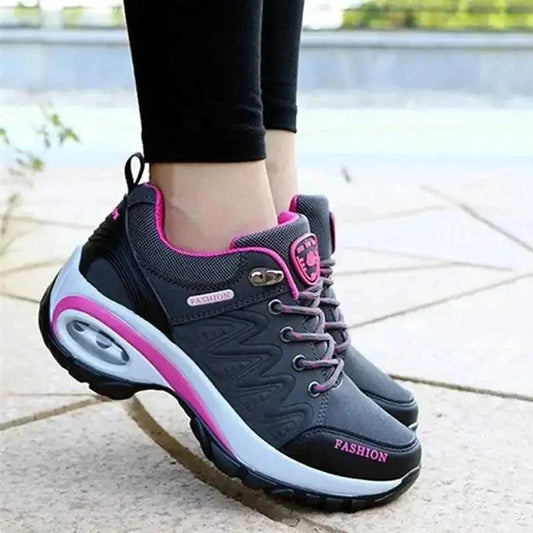 Mandotos running shoes in black and white with cushioned soles and breathable mesh upper for comfortable exercise.