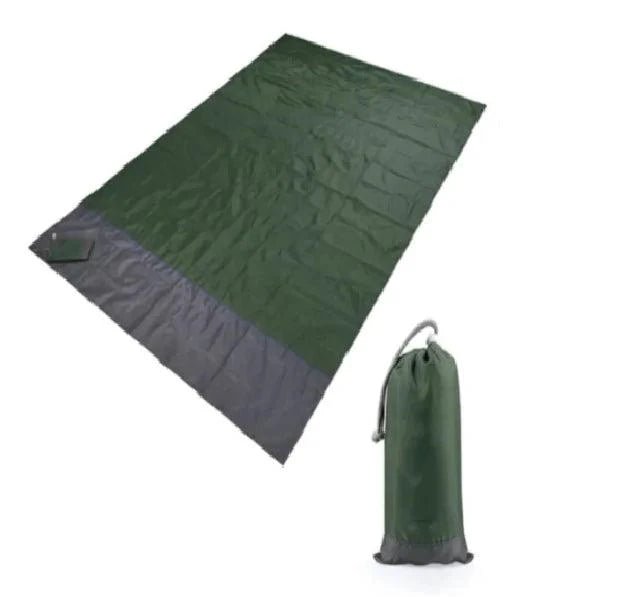 Mandotos sandproof portable beach mat spread out on sandy beach, lightweight and easy to carry for outdoor relaxation.