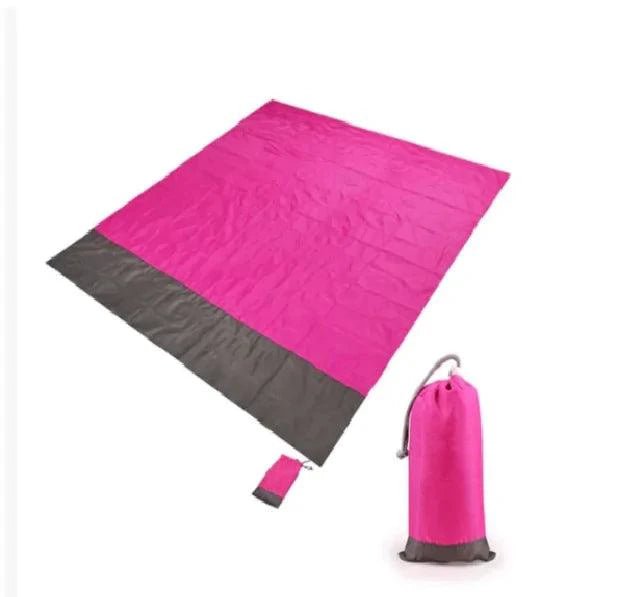 Mandotos sandproof portable beach mat spread on sandy shore, lightweight and easy to carry for beach outings.