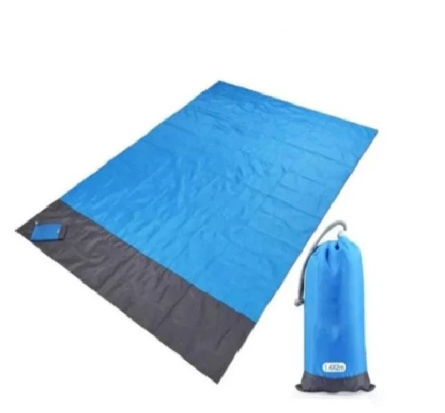 Mandotos sandproof portable beach mat laid out on sandy shore, lightweight and easy to carry for outdoor beach activities.