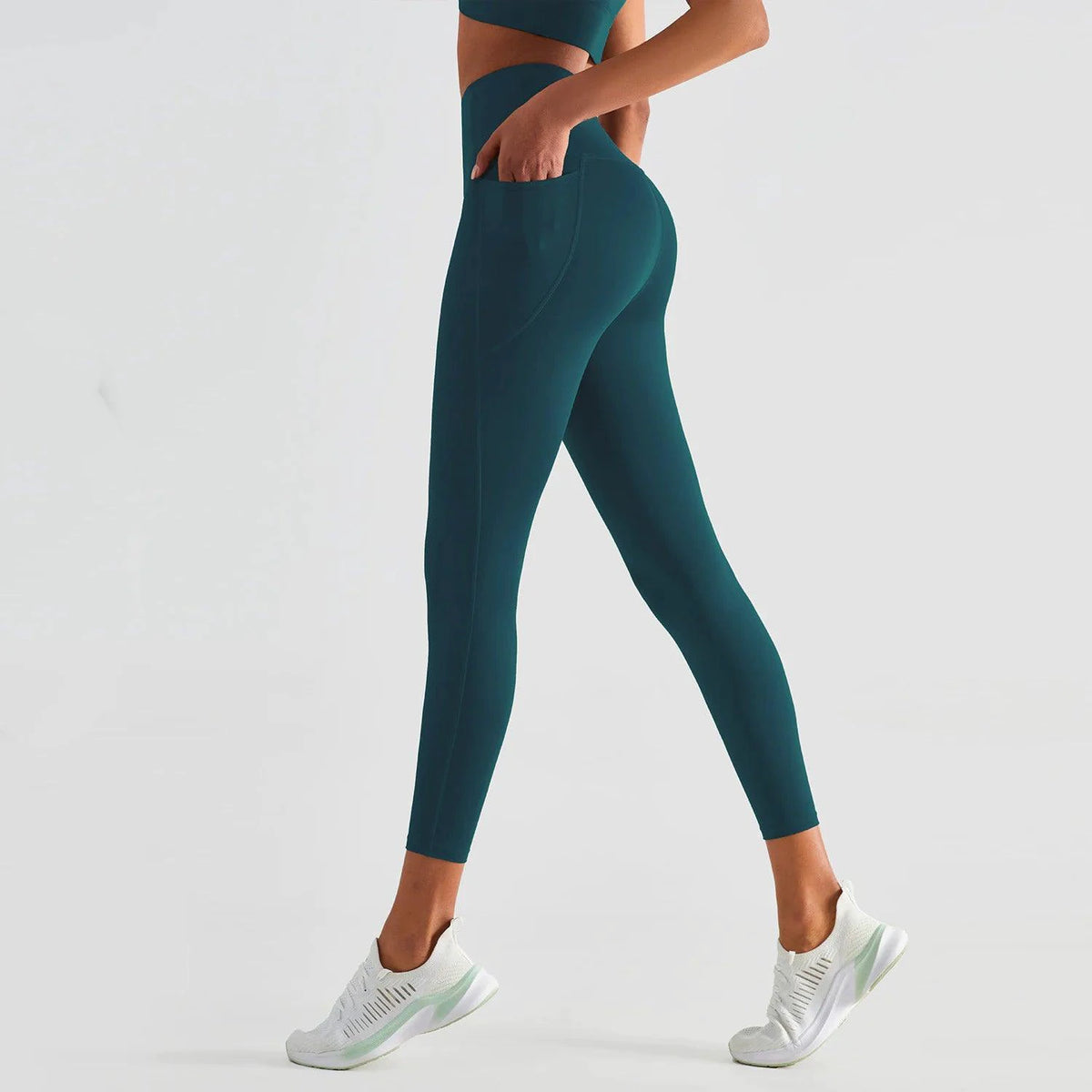 Mandotos ShapeEnhance activewear leggings showing a close-up of the black, high-waisted, stretchy fabric with contouring details.