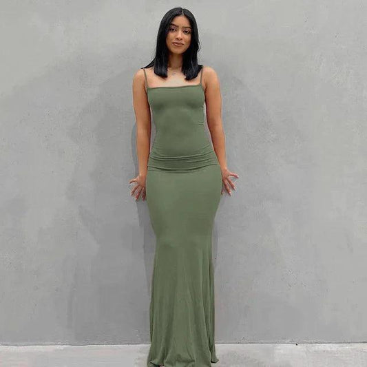 Elegant black satin backless gown by MANDOTOS, featuring a sleek design and flowing fabric for formal occasions.