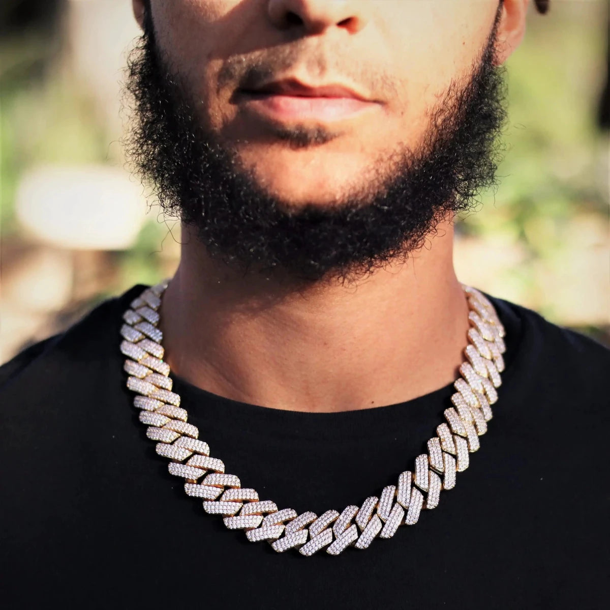 Mandotos triple row diamond gold Cuban chain showcasing sparkling diamonds and thick, luxurious gold links.