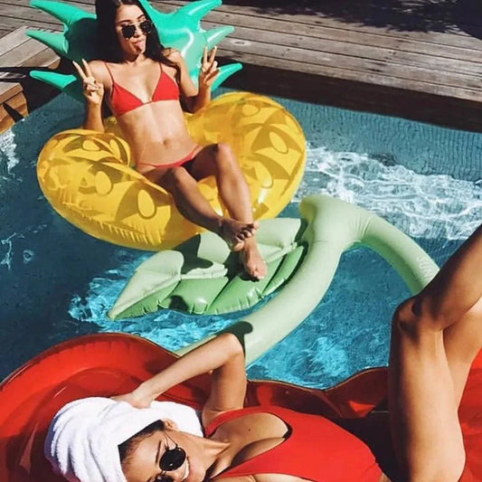 Colorful tropical pineapple water float by MANDOTOS, featuring a vibrant pineapple design perfect for pool lounging and fun outdoor activities.