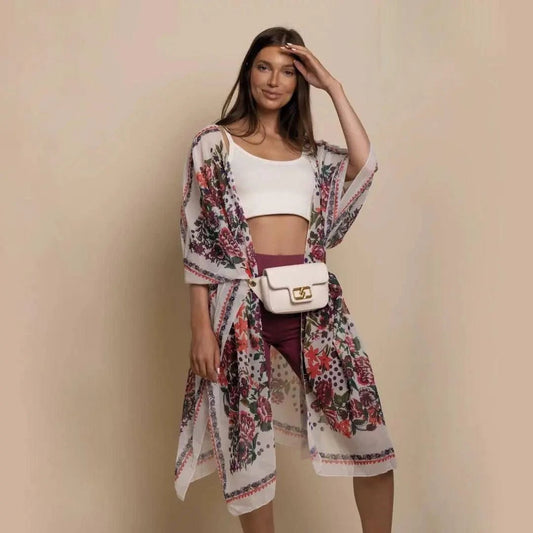 Mandotos Urban Blossom Kimono displayed on a hanger, featuring floral patterns and lightweight fabric for versatile styling.