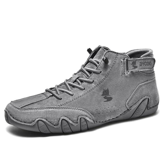 Black Winter Rider leather boots by MANDOTOS with sturdy soles and ankle height, perfect for cold weather and winter style.