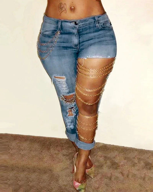 Mandotos women's denim pencil pants with big holes, chain detail, slim fit, pockets, stretch fabric, solid color, streetwear style.
