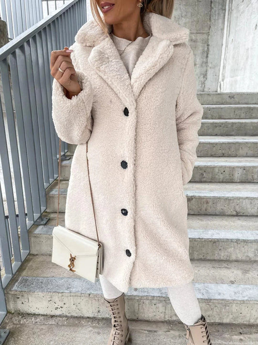 Women's MANDOTOS lamb wool coat, stylish and warm, shown in a cozy fit with a classic design suitable for winter wear.