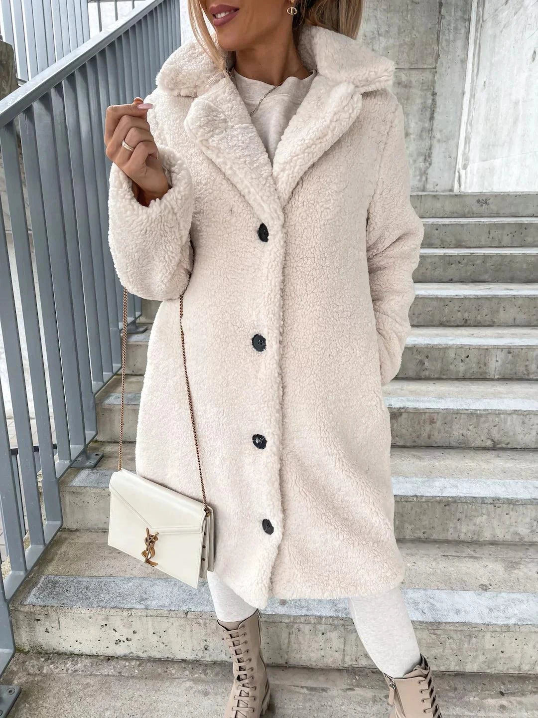 Women’s lamb wool coat by MANDOTOS, featuring a stylish, warm outerwear design with a tailored fit and classic lapel collar.