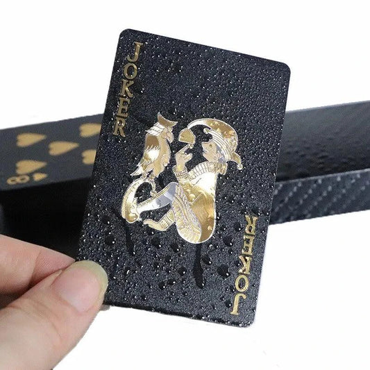 Black and gold waterproof playing cards for poker and magic tricks, part of a collectible card game set.