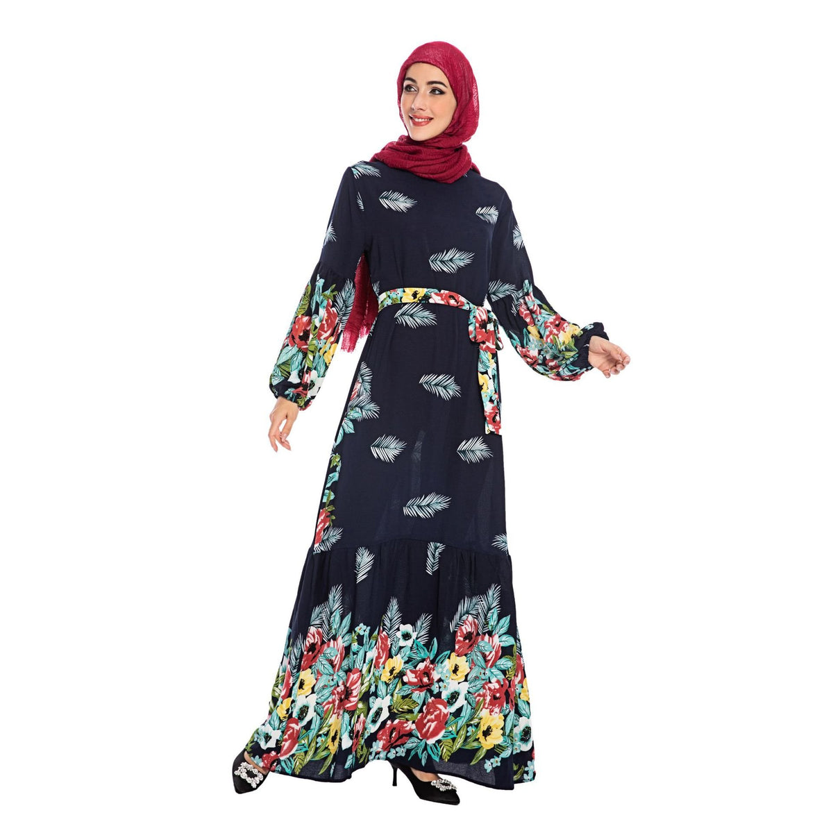 Woman wearing a Mandotos International Euro-American floral swing dress and red hijab.