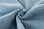 Soft blue knit fabric texture, ideal for premium fashion apparel and cozy wear