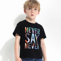 Kids black graphic tee with 'NEVER SAY NEVER' rainbow galaxy print, casual fashion for boys