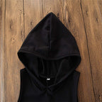 Black hooded sleeveless top on wooden background, stylish casual fashion