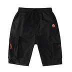 Black cargo shorts with orange alien patch and side pockets, stylish streetwear for men
