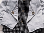 Gray cardigan with gold buttons over black polka dot blouse, stylish women's fashion outfit