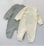 Soft baby rompers in gray and cream, cozy long-sleeve one-piece outfits for infants