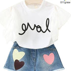 White 'love' graphic tee with ruffle sleeves and heart-patch denim shorts for kids