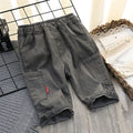 Light blue cotton children's pants from Ancient Energy, loose summer pants for middle school kids with a thin, breathable design.