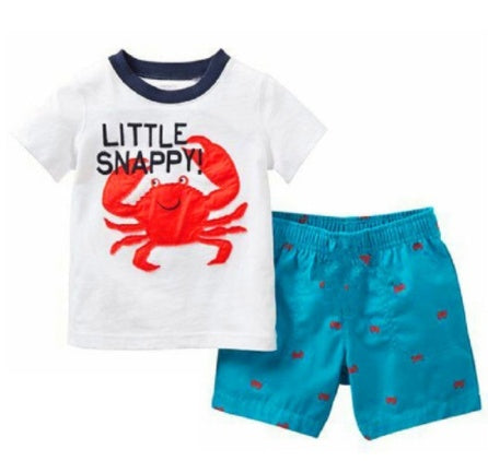 Young boy in Ancient Energy summer suit, children’s clothes, casual boys’ summer outfit with shorts and a t-shirt.