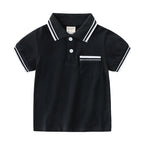 Young boy wearing a blue summer polo t-shirt by Ancient Energy, casual style perfect for warm weather.